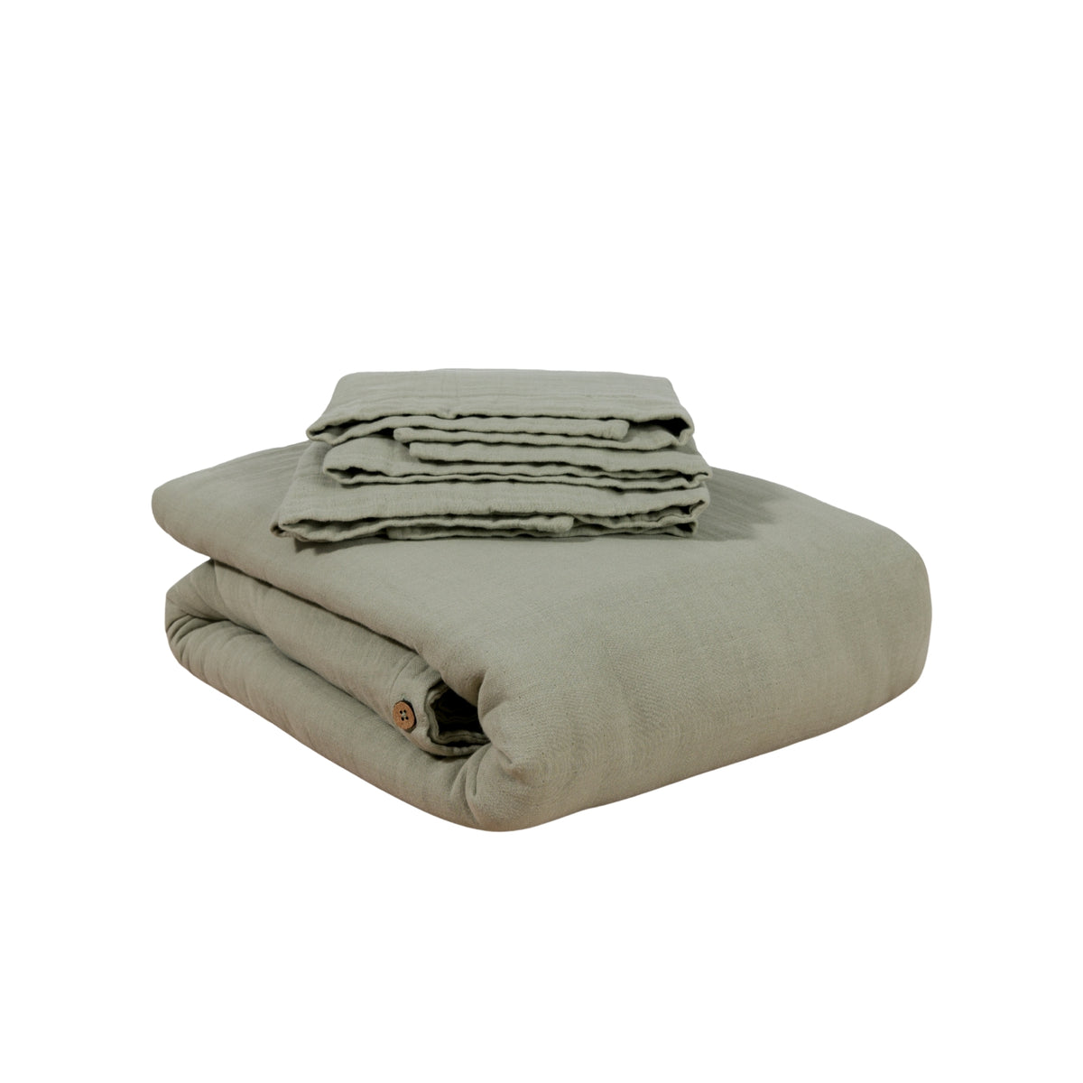 Folded duvet set against a white background #color_forest canopy