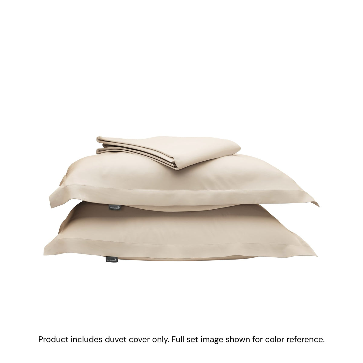 A folded duvet cover sitting on top of two pillow shams #color_undyed