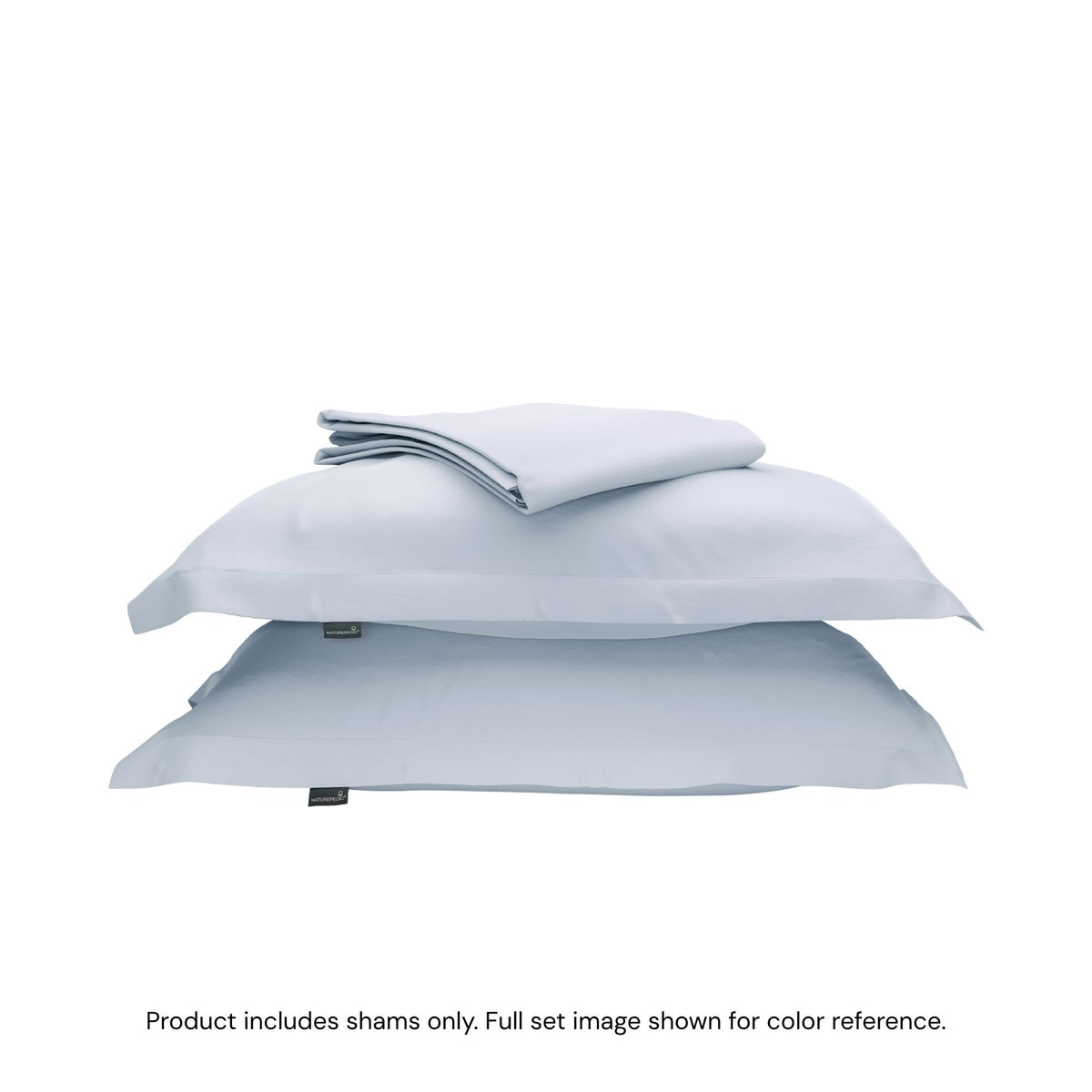 A duvet cover folded on top of two pillow shams #color_washed cornflower
