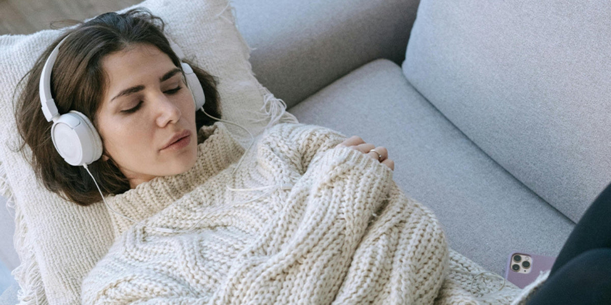 woman sleeping with headphones on