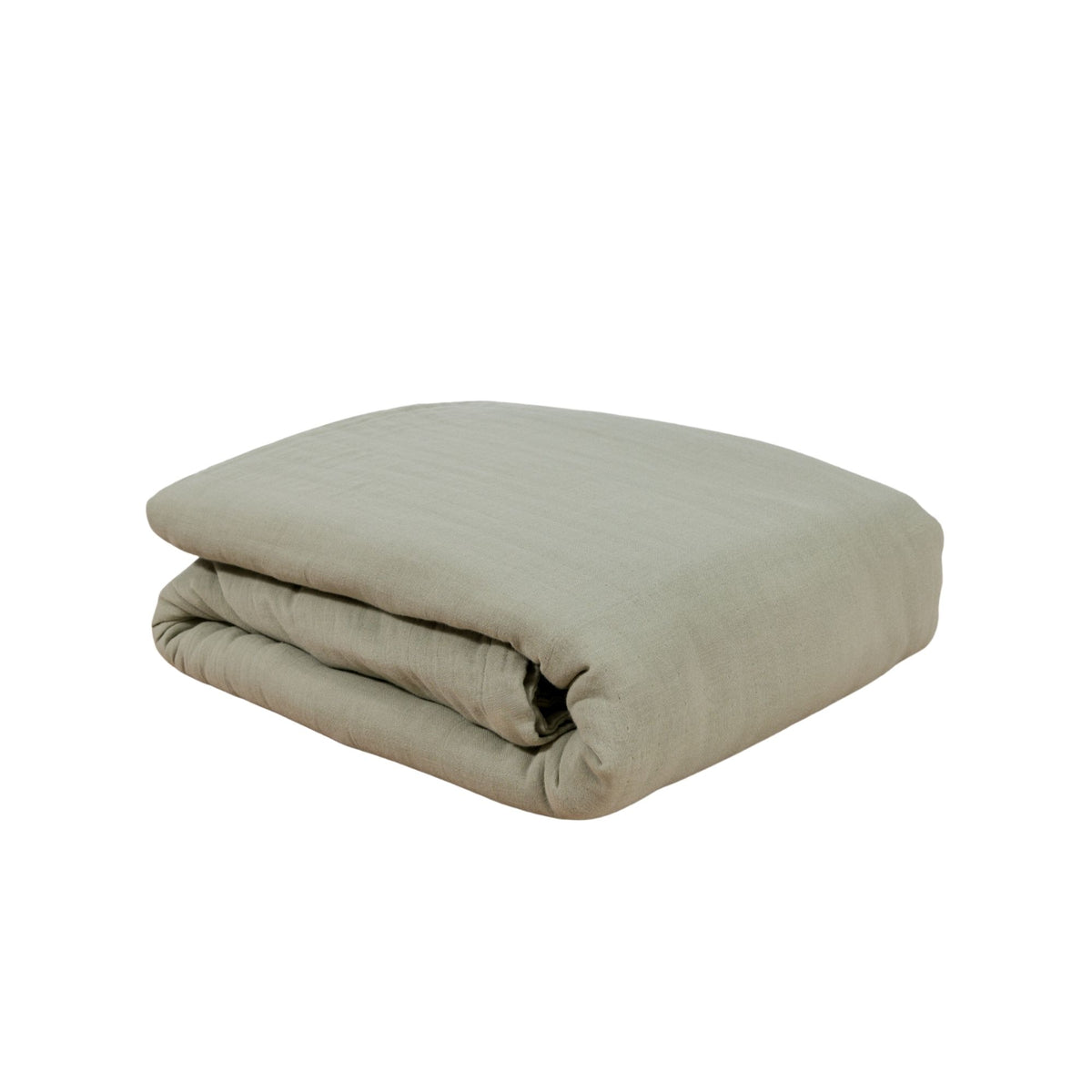 A folded white duvet cover on a solid white background #color_forest canopy