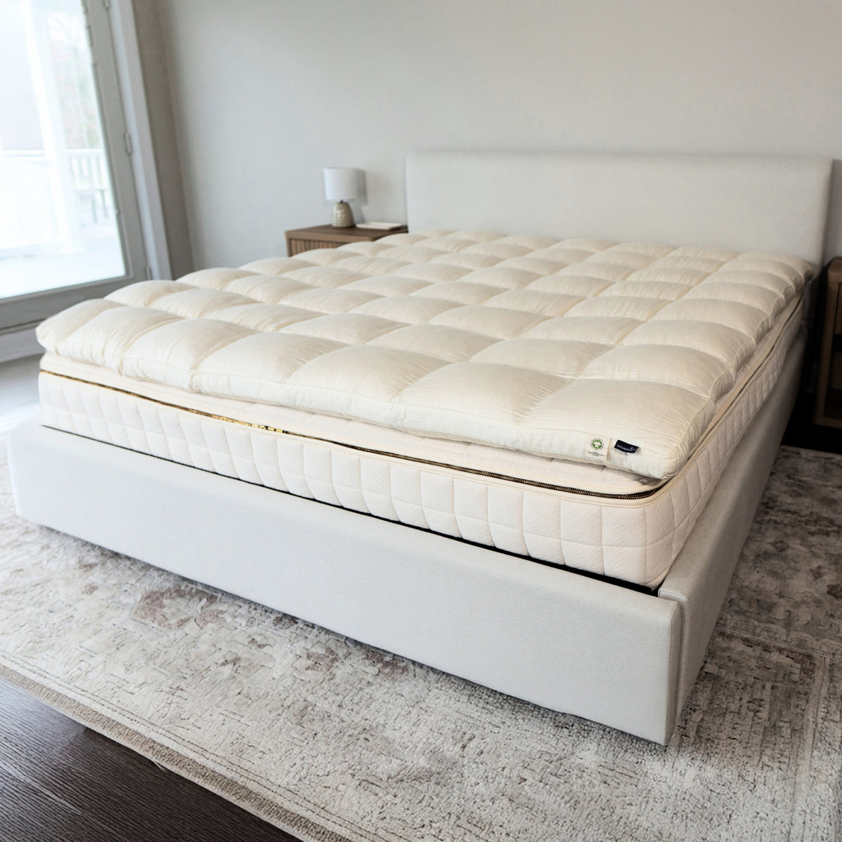 Mattress topper on a bed in a bedroom setting