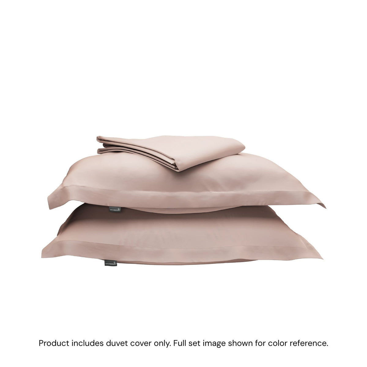 A folded duvet cover sitting on top of two pillow shams #color_petal