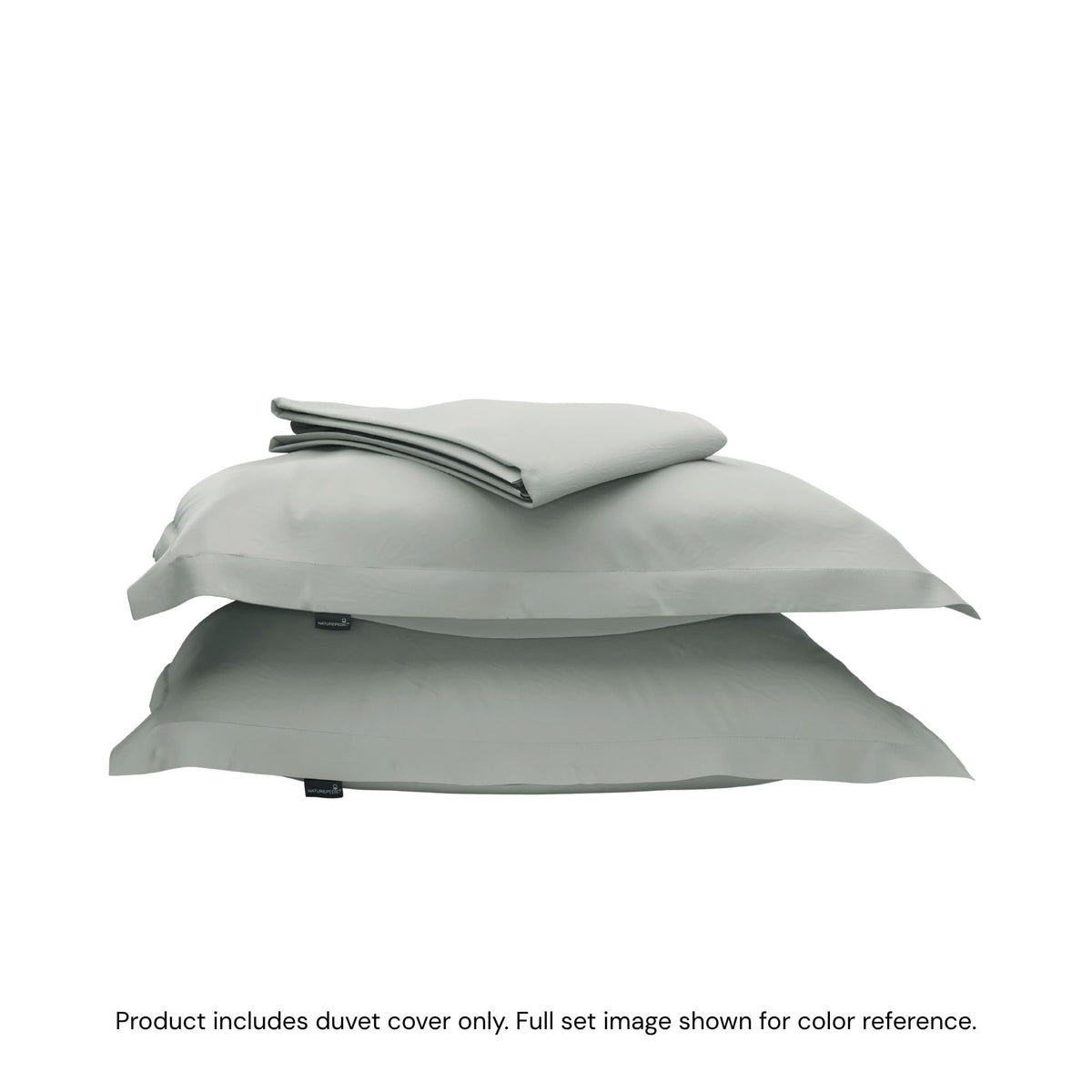 A folded duvet cover on top of two shams against a white background #color_sage