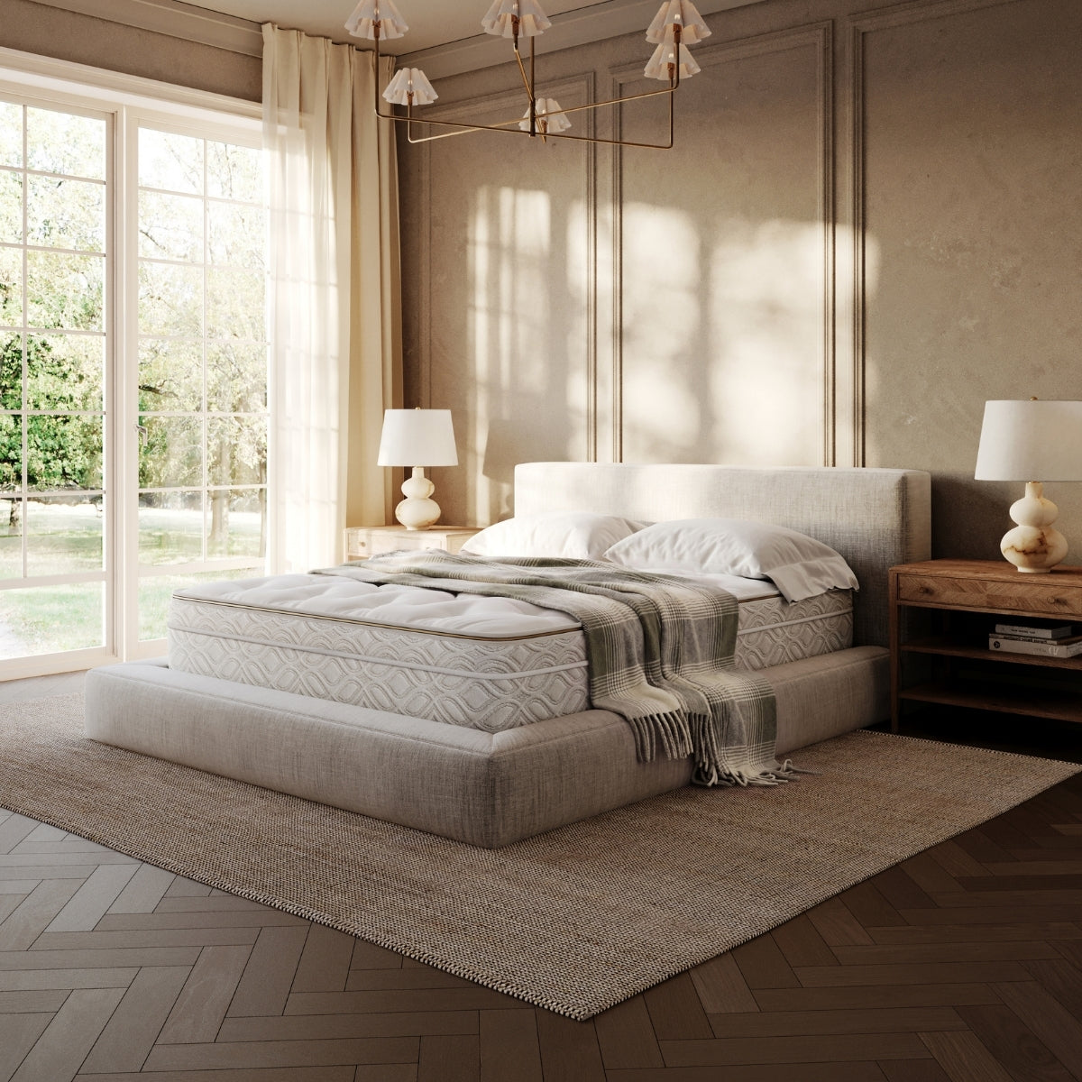 Neatly made bed in a stylish bedroom with large windows and decorative elements.