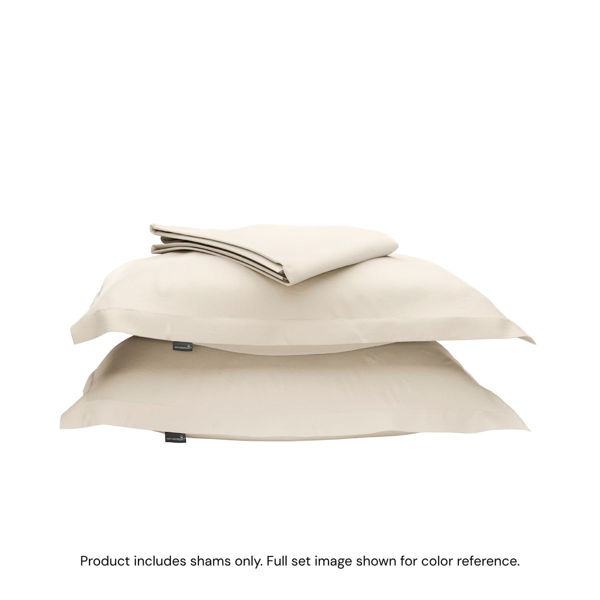 A duvet cover folded on top of two pillow shams #color_undyed