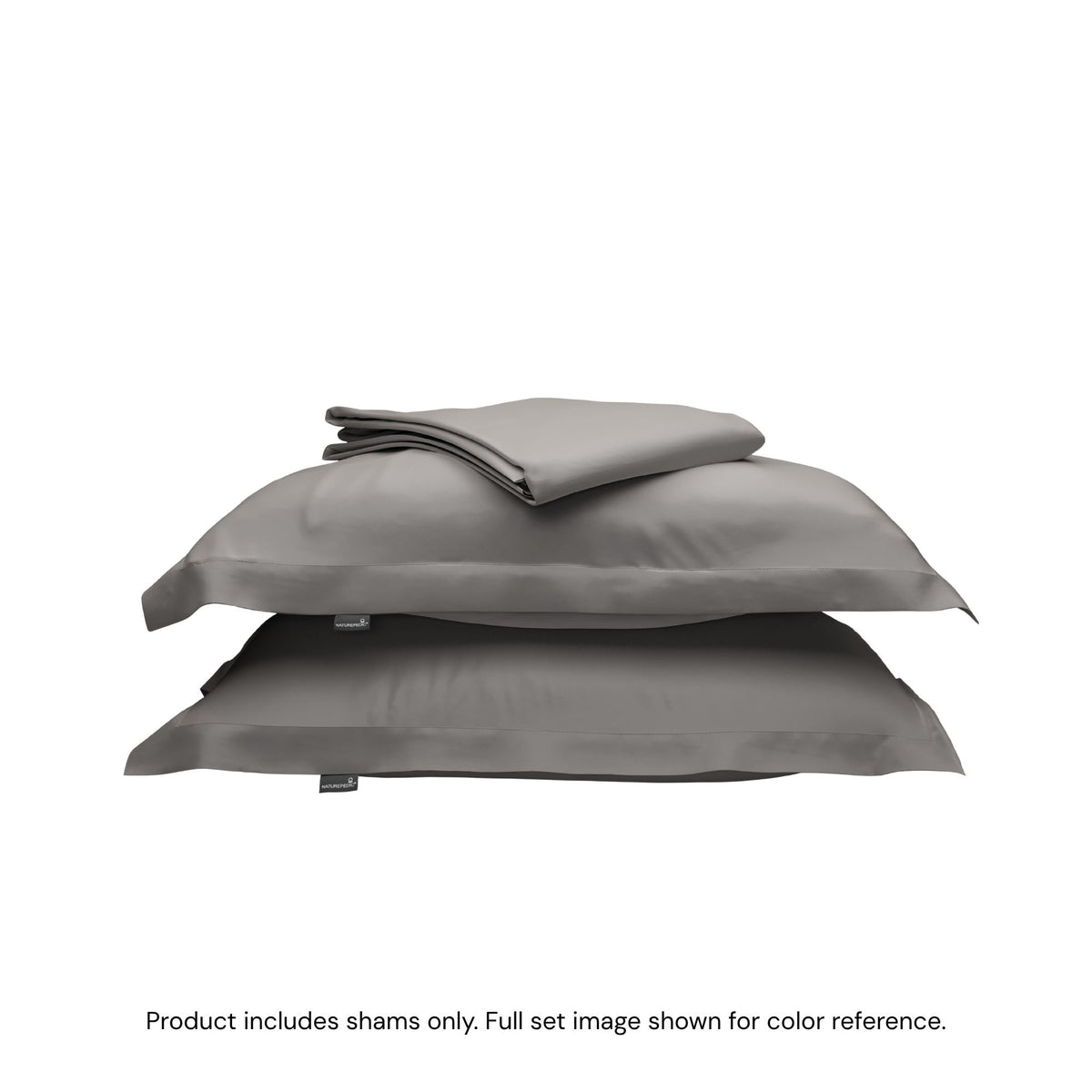 A folded duvet cover on top of two pillow shams. #color_pebble grey